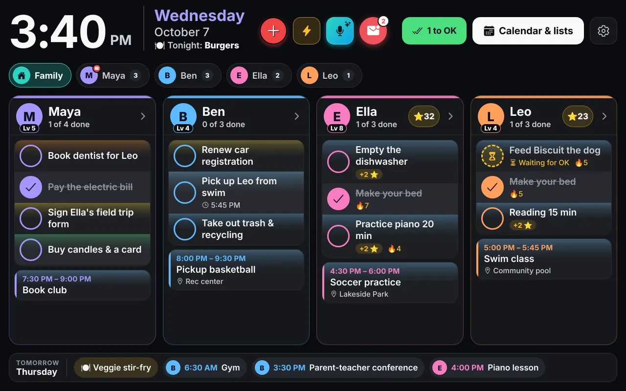 The Wall in the dark theme, with the clock, everyone's columns and tomorrow's plans along the bottom